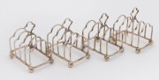 Set of four sterling silver toast racks, Sheffield, circa 1921, ​7cm high, 7cm wide, 152 grams total