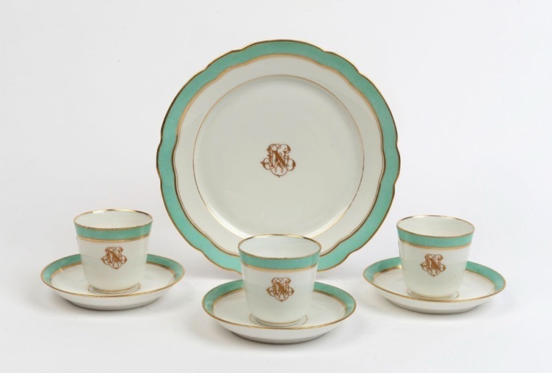 Three antique porcelain cups, saucers and matching plate with Napoleonic style monogram, 19th century, (7 items), the plate 22cm diameter