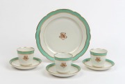 Three antique porcelain cups, saucers and matching plate with Napoleonic style monogram, 19th century, (7 items), the plate 22cm diameter