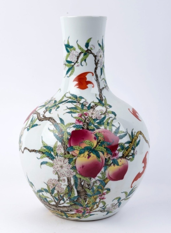 A Chinese spherical porcelain vase decorated with peaches, hibiscus and flying bats, 20th century, blue Qianlong mark, ​39cm high