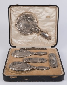 An English sterling silver vanity set in original case, made in Birmingham, circa 1916, the case 35cm wide