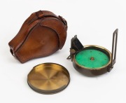 An antique pocket compass in original leather pouch, 19th century, ​8cm diameter