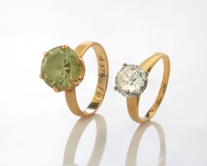 Two 9ct gold lady's dress rings with solitaire stones, ​​​​​​​8.8 grams total