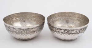 A pair of Eastern silver bowls with engraved decoration, 19th century, 5cm high, 10.5cm diameter, 132 grams total