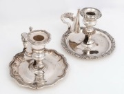 Two Georgian Sheffield plate chamber sticks with snuffers, 19th century, the larger 12cm hig, 18cm wide