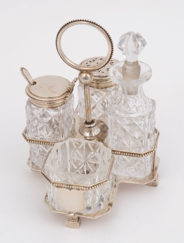 An antique sterling silver four bottle cruet set, Sheffield, circa 1887, ​​​​​​​14.5cm high, 182 grams silver weight