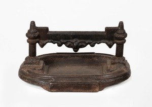 An antique cast iron boot scraper, 19th century, ​​​​​​​19cm high, 37cm wide