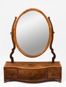A Georgian mahogany toilet mirror with serpentine front, early 19th century, 70cm high, 51cm wide, 20cm deep