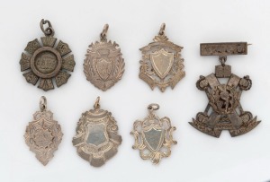 Seven assorted antique silver medals and fobs, 19th and early 20th century, ​​​​​​​the largest 6cm high, 