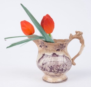 Three glass tulips in an antique porcelain jug,19th and 20th century (one stem damaged), the tulips 19cm high