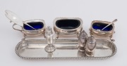 Sterling silver pen tray, assorted condiments, salts and peppers, (8 items), ​​​​​​​the tray 21cm wide, 346 grams silver weight