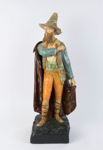 An antique Continental statue of a man in a hat, glazed chalk ware, 19th century, 73cm high