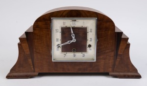 A German Art Deco mantel clock with three train quarter-striking movement in walnut veneer case, 23cm high, 47cm wide, circa 1930.