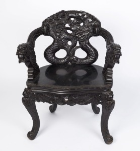 An antique Chinese armchair, carved and ebonized wood with dragon decoration, 19th century, ​​​​​​​88cm high, 69cm across the arms