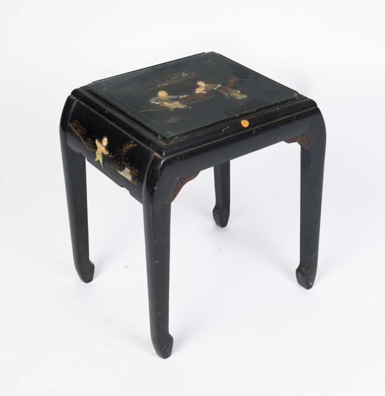 A Chinese occasional table, black lacquered finish with gilt and applied decoration, 20th century, 43cm high, 39cm wide, 31cm deep