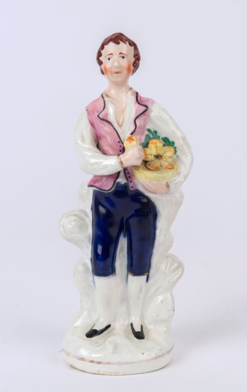 STAFFORDSHIRE pottery statue of a man with flowers, 19th century, ​​​​​​​19.5cm high