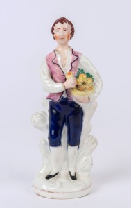STAFFORDSHIRE pottery statue of a man with flowers, 19th century, 19.5cm high