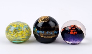 Three assorted glass paperweights, 20th century, the largest 6.5cm high