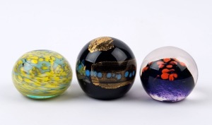 Three assorted glass paperweights, 20th century, ​​​​​​​the largest 6.5cm high