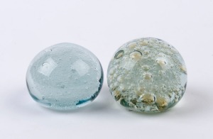 Two art glass paperweights with bubble inclusions, 20th century, ​​​​​​​the larger 5.5cm high