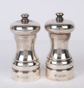 A pair of English sterling silver pepper grinders, London, 20th century, ​​​​​​​10cm high