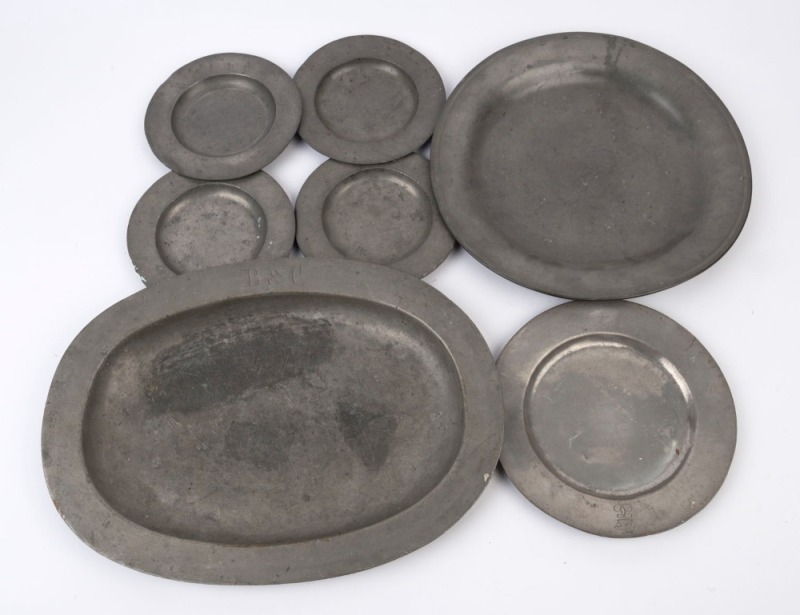 Seven assorted antique pewter plates and serving dishes, 18th/19th century, ​the largest 45cm wide