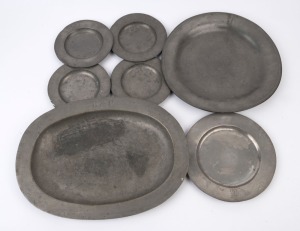 Seven assorted antique pewter plates and serving dishes, 18th/19th century, ​the largest 45cm wide