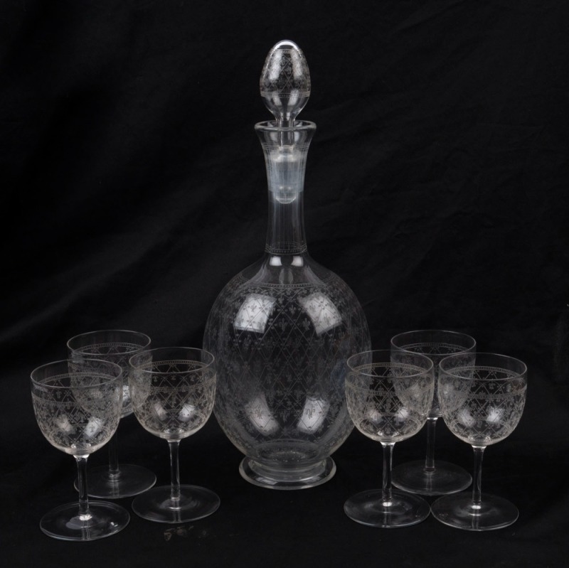 Glass decanter and matching set of six glasses with etched Fleur-De-Lis pattern, 19th century, (7 items), ​the decanter 30cm high