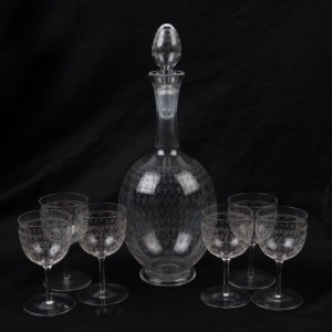 Glass decanter and matching set of six glasses with etched Fleur-De-Lis pattern, 19th century, (7 items), the decanter 30cm high