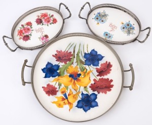 Three German floral porcelain serving trays with silver plated galleries, early 20th century, the largest 43cm across the handles