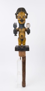 A tribal figure, carved wood and cloth with yellow and blue painted finish, African origin, 88cm high overall