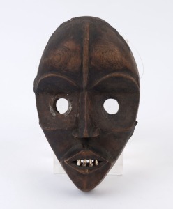 A tribal dance mask, carved wood, metal and tooth, Dan Tribe, Congo, ​​​​​​​25.5cm high