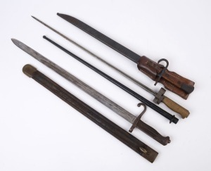Three antique and vintage bayonets, 19th and 20th century, ​​​​​​​the largest 50cm long