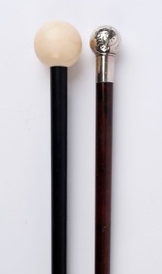 Two antique walking sticks, both with ebony shafts, one with silver top the other turned ivory, 19th century, ​84cm and 91cm high
