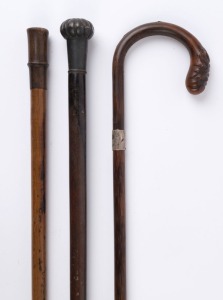 Three antique walking sticks, 19th century, ​​​​​​​the largest 91cm high