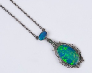 A vintage silver necklace set with opal doublets and marcasite, early 20th century, the pendant 4cm high