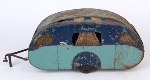 A scratch-built two wheel caravan, painted metal with rubber tread tyres and lace curtains; incomplete, circa 1935, 52cm long, 17.5cm wide