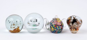 Four assorted art glass paperweights including teapot example, 20th century, the largest 8cm tall