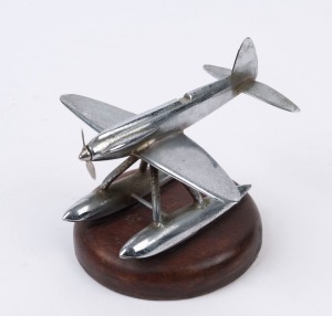 A chrome aeroplane desk ornament, mid 20th century, ​​​​​​​12cm high, 14cm long