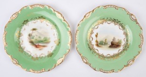 A pair of antique English porcelain cabinet plates with hand-painted castle scene landscapes and green border, early 19th century, 23cm diameter