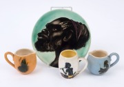 MARTIN BOYD pottery plaque of an Aboriginal man and three small pottery jugs, (4 items), the plaque 18cm diameter