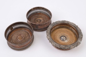 Three antique wine bottle coasters, 19th century, the largest 5cm high, 17cm diameter