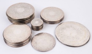 Set of silver plated place mats, setting for 10 with the extra serving mats, (33 items) the largest 23cm diameter