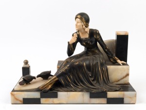 A French Art Deco statue of a seated lady with doves, patinated spelter, ivoreen and marble, circa 1930, 31cm high, 42cm wide, 20cm deep