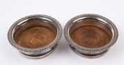 A pair of antique silver plated wine bottle coasters, 19th century, 5cm high, 15cm diameter