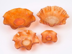 CARNIVAL GLASS, four assorted marigold bowls, circa 1930s, the largest 22.5cm wide