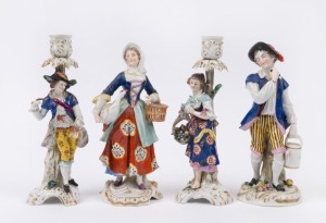 A pair of antique German figural porcelain candlesticks and a pair of peasant statues, (A/F), 19th century, the largest 24cm high