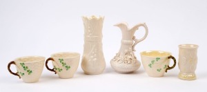 BELLEEK Irish porcelain jug, two vases and three teacups,19th and 20th century, (6 items), black, brown and green marks, the largest 16cm high