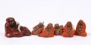 Six assorted Japanese seated ceramic figures, 20th century, the largest 5cm high