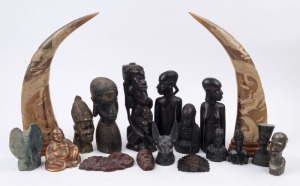 Collection of tribal and ethnographic ornaments including African, Chinese and Asian, carved wood, horn, metal, stone and resin, 20th century, (18 items), 43cm high